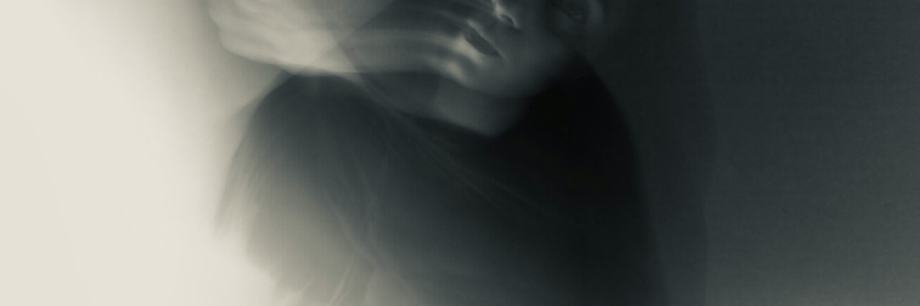 ghostly image of distressed woman